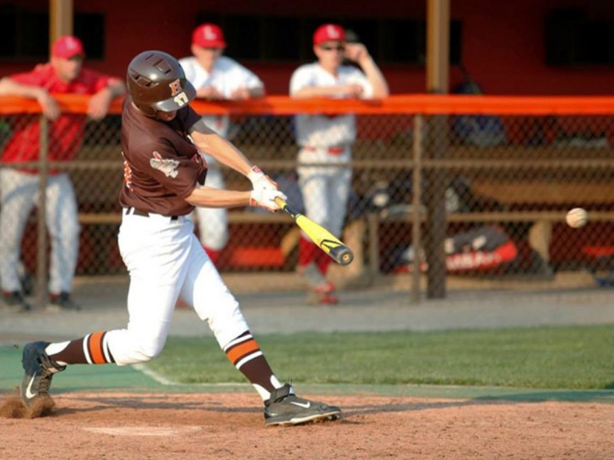 Baseball player hitting a baseball