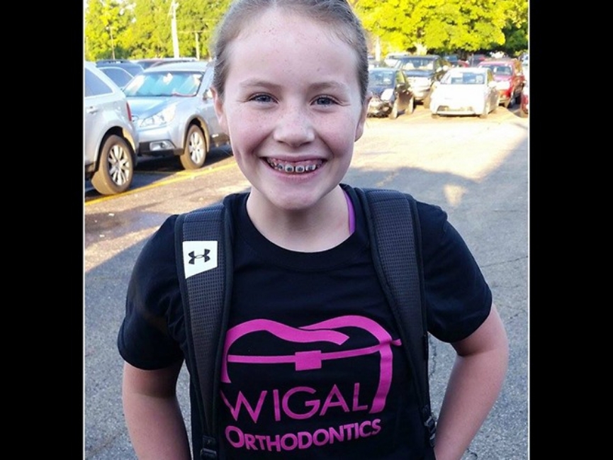 Close up of girl with braces and backpack