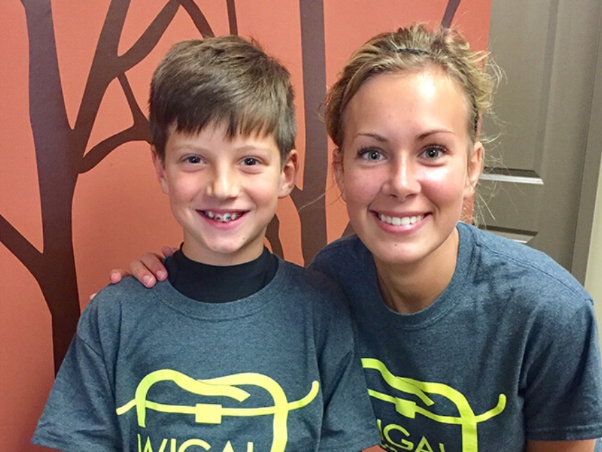 Close up of woman and little boy with braces