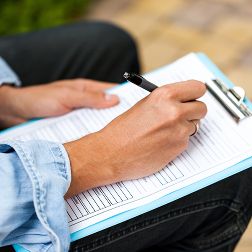 Close up of writing on clipboard