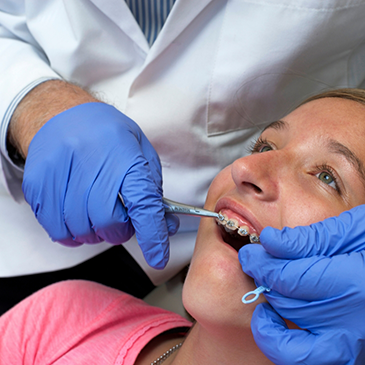 Patient receiving treatment from orthodontist