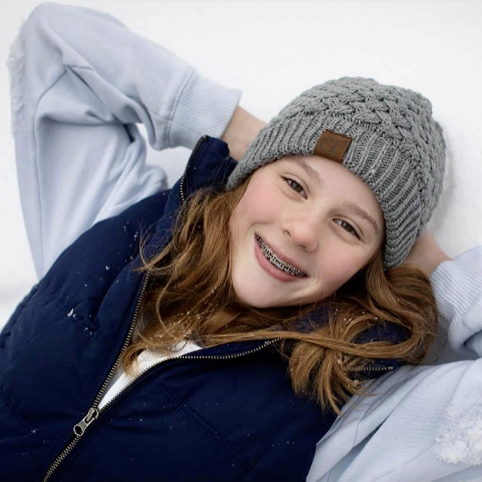 Girl with beanie and traditional braces in Columbus